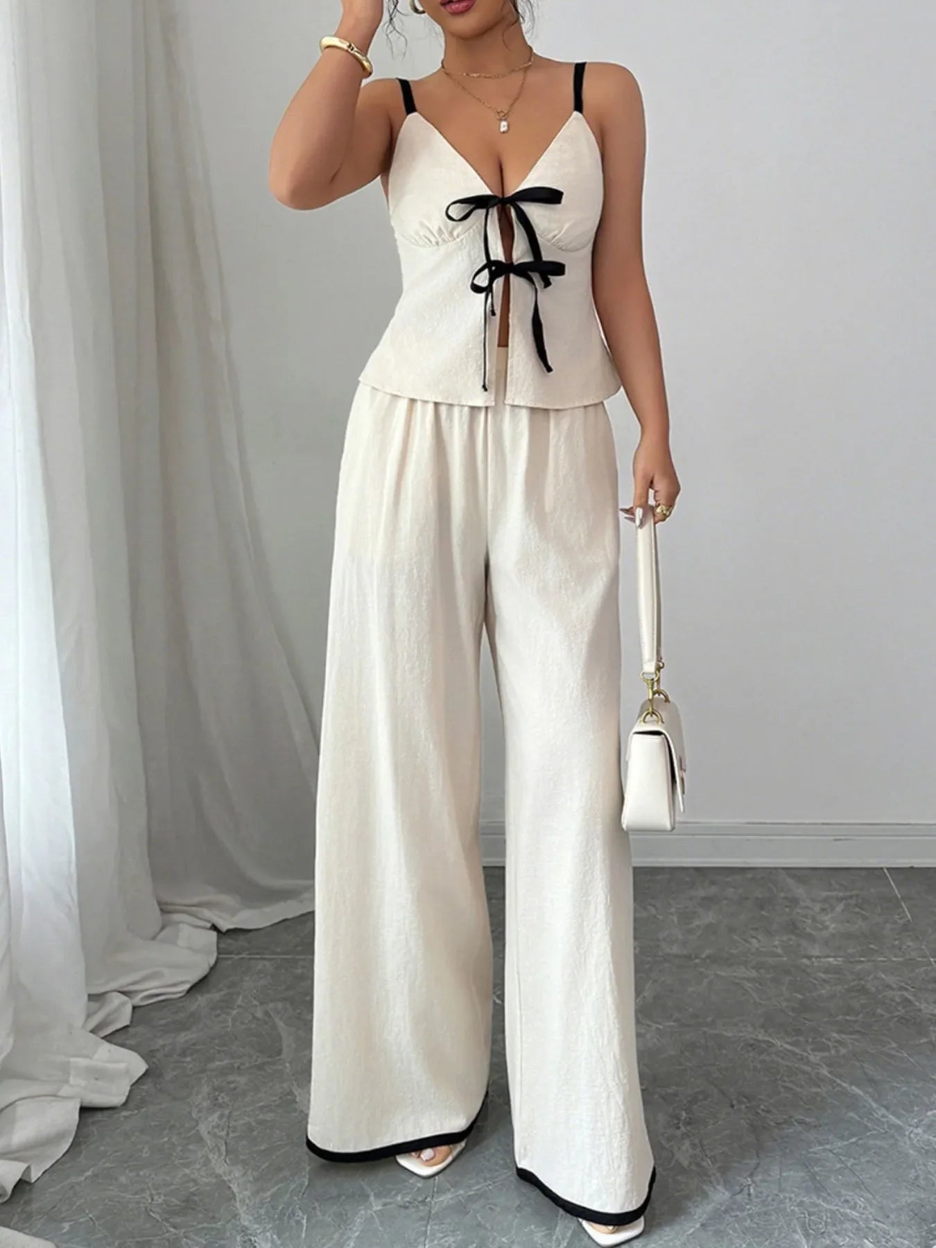 Striking, confident clothing set featuring bold silhouette and refined, modern detailing